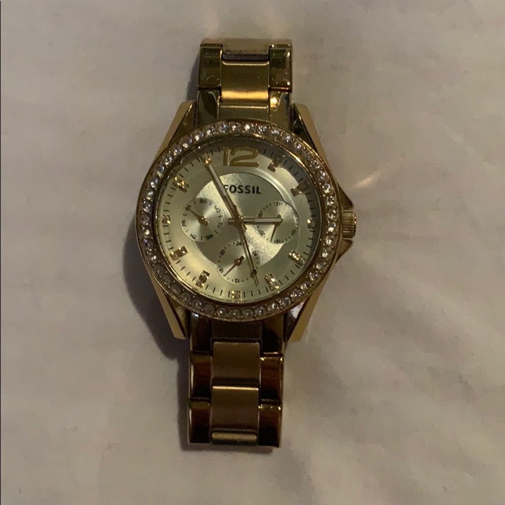 Gold fossil watch